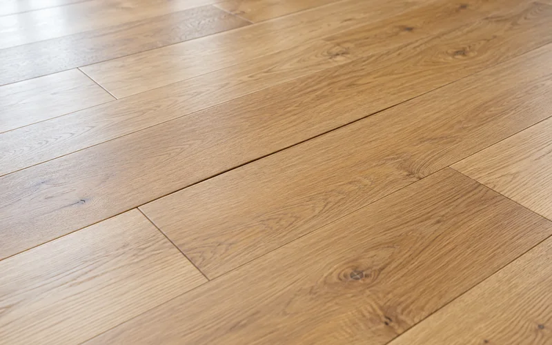 Oak floorboards with a narrow gap between boards